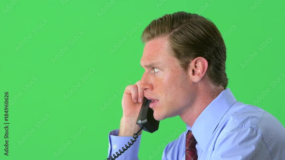 Businessman on the phone on greenscreen Businessman on the phone on greenscreen