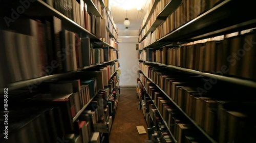 The dark library, the books are falling, a strange terrible woman with a candle in her hands.