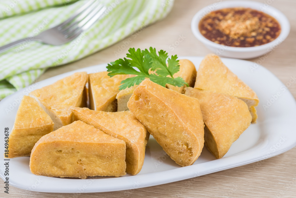 Fried tofu on plate and dip sauce Fried tofu on plate and dip sauce