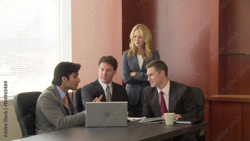 Portrait of business executive with conference in background Portrait of business executive with conference in background