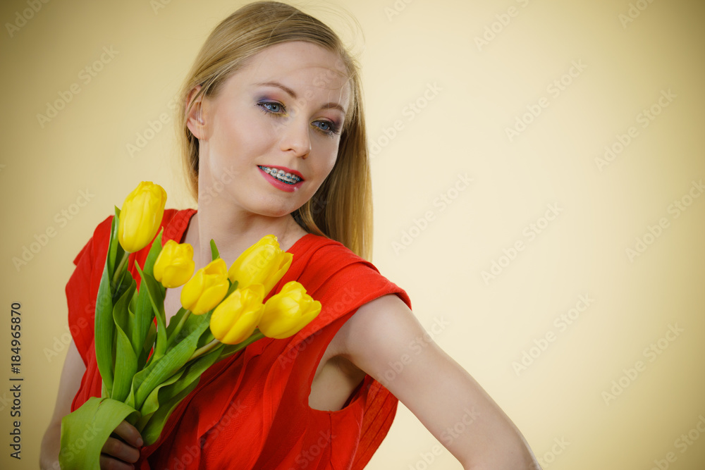 Pretty woman with yellow tulips bunch Pretty woman with yellow tulips bunch