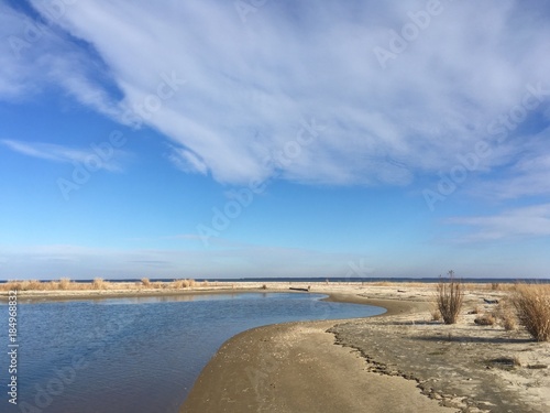 sand dunes and clouds by Chesapeake Bay