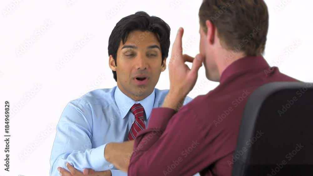 confident businessman sitting at his desk on greenscreen confident businessman sitting at his desk on greenscreen