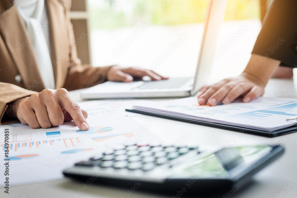 Administrator business man financial inspector and secretary making report, calculating balance. Internal Revenue Service checking document. Audit concept. Administrator business man financial inspector and secretary making report, calculating balance. Internal Revenue Service checking document. Audit concept.