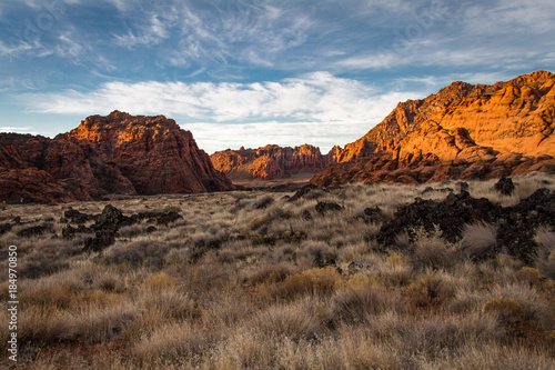 Gorgeous early winter glowing view of The sandstone and volcanic rock of Snow Canyon State Park in southern Utah.