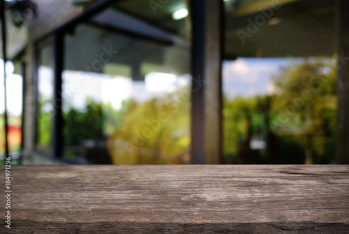 Wallpaper Mural Empty wooden table in front of abstract blurred background of coffee shop . can be used for display or montage your products.Mock up for display of product. Torontodigital.ca