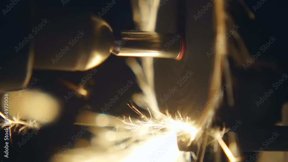 Grinder processes the part and flies a lot of sparks on black background. S-log - High Dynamic Range. Macro. Closeup. Slow mo, slo mo, slow motion, high speed camera, 240fps, 250fps Grinder processes the part and flies a lot of sparks on black background. S-log - High Dynamic Range. Macro. Closeup. Slow mo, slo mo, slow motion, high speed camera, 240fps, 250fps