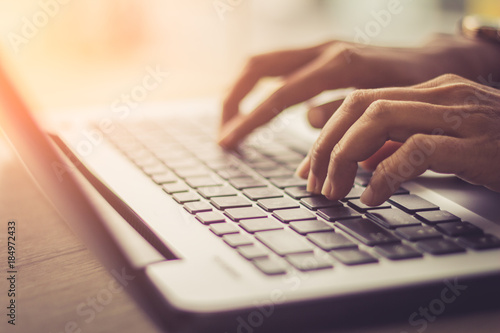 woman using laptop, searching web, browsing information, having workplace at home  / soft focus picture / Vintage concept photo
