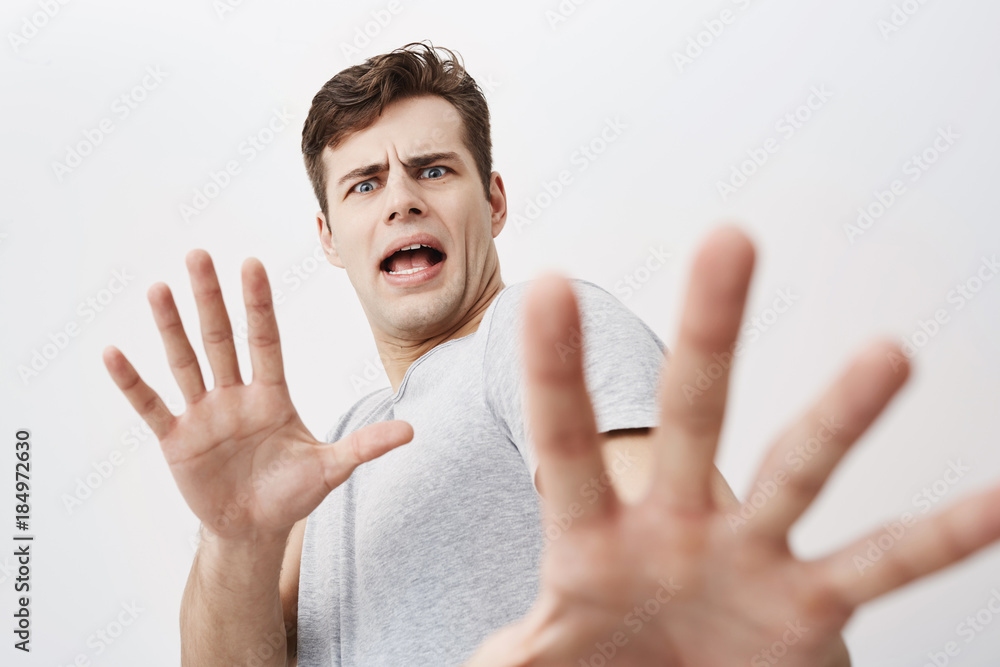 Man scared hands face hi-res stock photography and images - Alamy