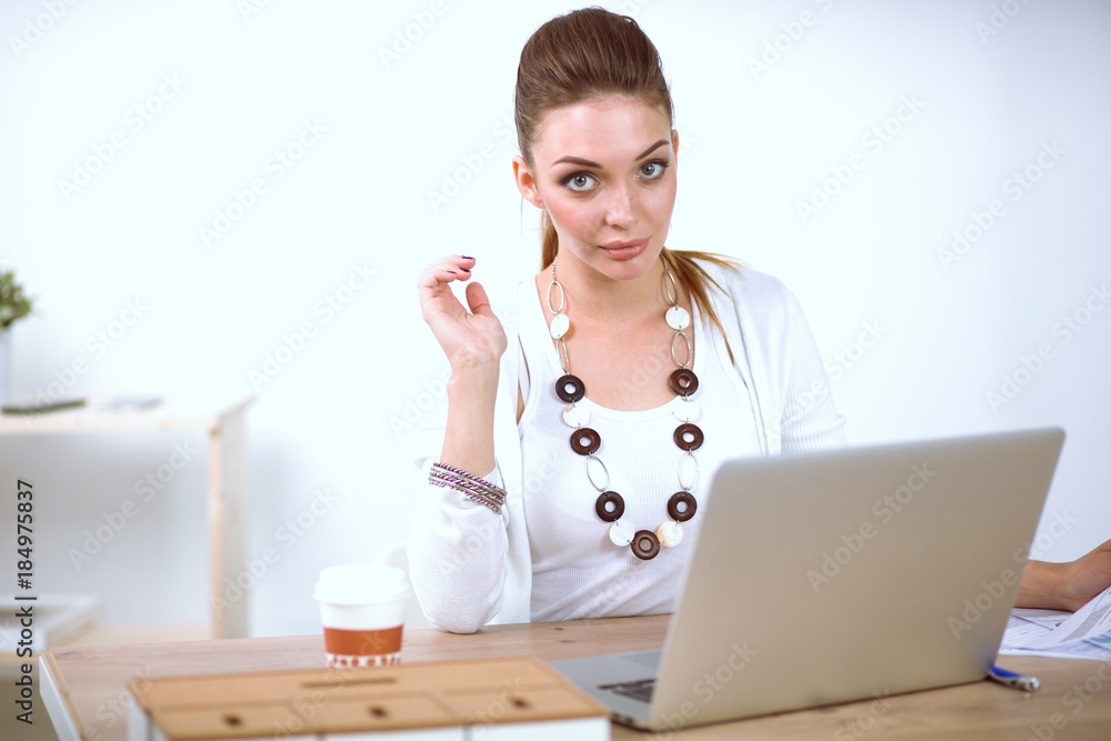 Young beautiful woman using a laptop computer at home. Young beautiful woman Young beautiful woman using a laptop computer at home. Young beautiful woman
