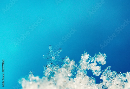 natural snowflakes on snow.