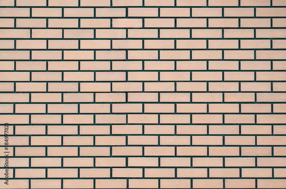 Texture of a colored brick with cement wall, close-up, abstract background for print design Texture of a colored brick with cement wall, close-up, abstract background for print design