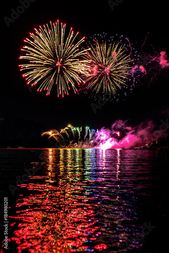 A colorful firework with reflection