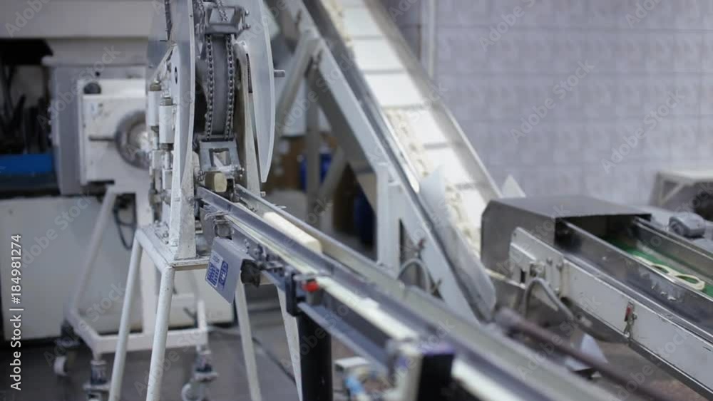 Conveyor belt with slices of soap Conveyor belt with slices of soap