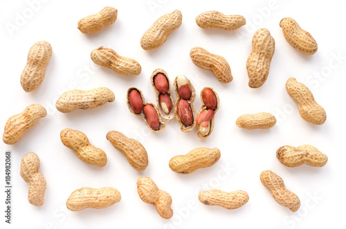 Photography Isolated unpeeled groundnut and red seeds