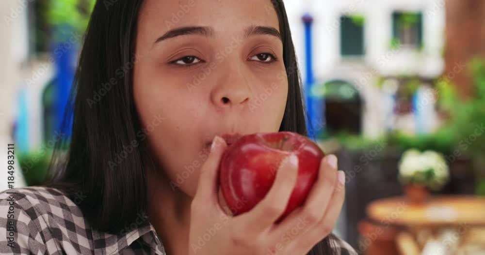 Latina savors the flavor of a fresh apple on a nice day in Italy. Hispanic woman enjoys a delicious apple in Venice. 4k Latina savors the flavor of a fresh apple on a nice day in Italy. Hispanic woman enjoys a delicious apple in Venice. 4k
