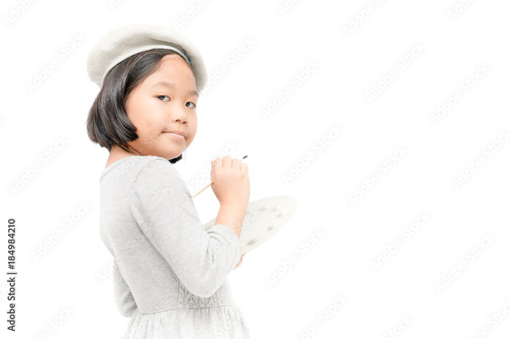 little girl painter posing with a brush and palette. Isolated little girl painter posing with a brush and palette. Isolated