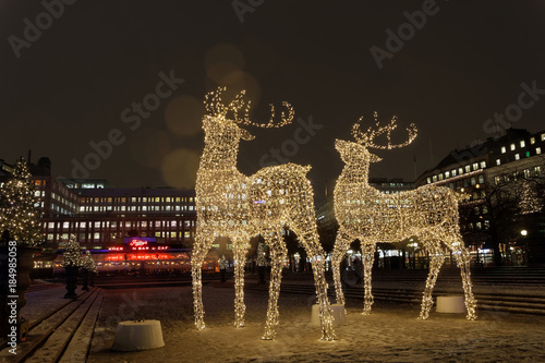 Fototapeta Naklejka Na Ścianę i Meble -  Gigantic reindeers christmas decoration made of led light