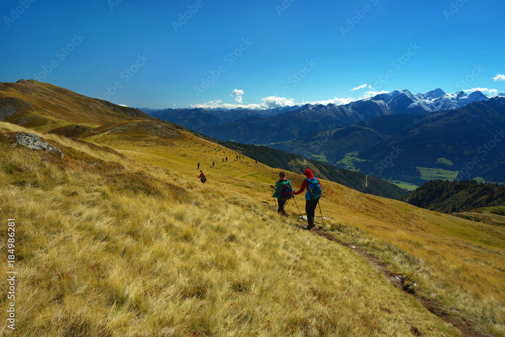Tourist on the mountain way with Hohe Tauern on backround, Austria
