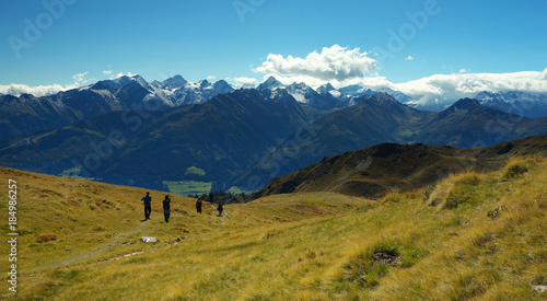 Tourist on the mountain way with Hohe Tauern on backround, Austria © Tulda