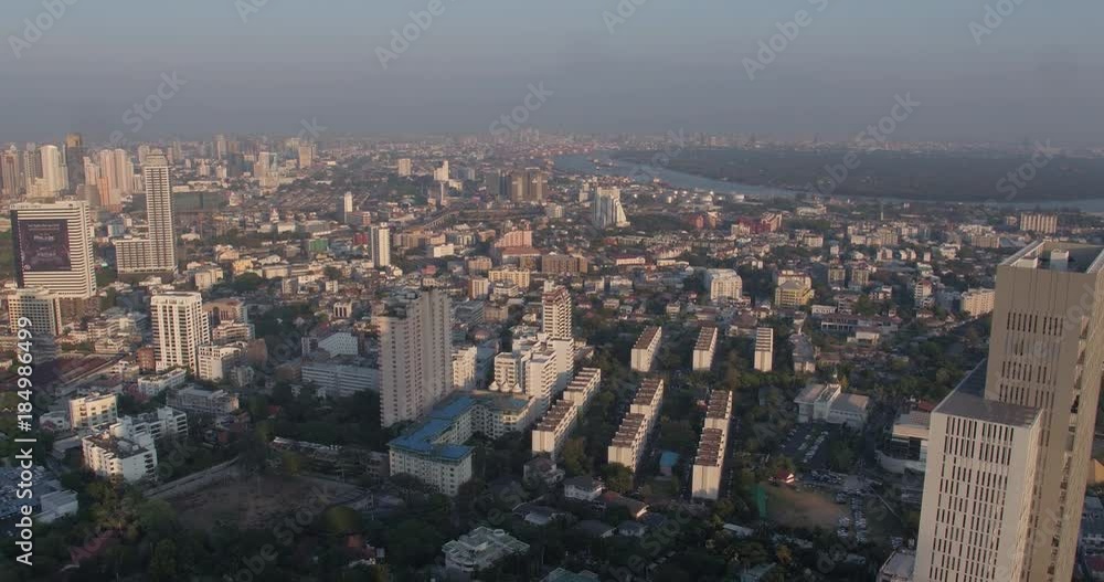 BANGKOK, THAILAND, MARCH 2017: Aerial view over housing area in Central Bangkok at sunset BANGKOK, THAILAND, MARCH 2017: Aerial view over housing area in Central Bangkok at sunset