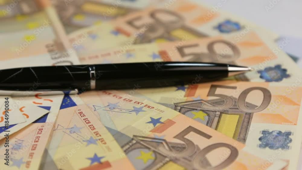 Rotation pen, lying on the background of euros. Rotation pen, lying on the background of euros.