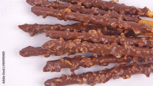 Biscuit stick dipped with chocolate almond nuts