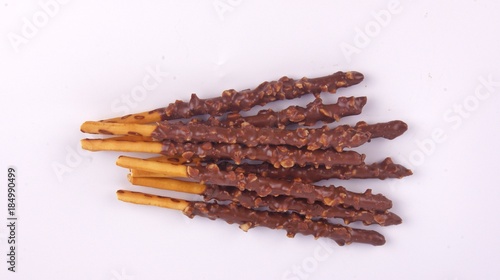 Biscuit stick dipped with chocolate almond nuts