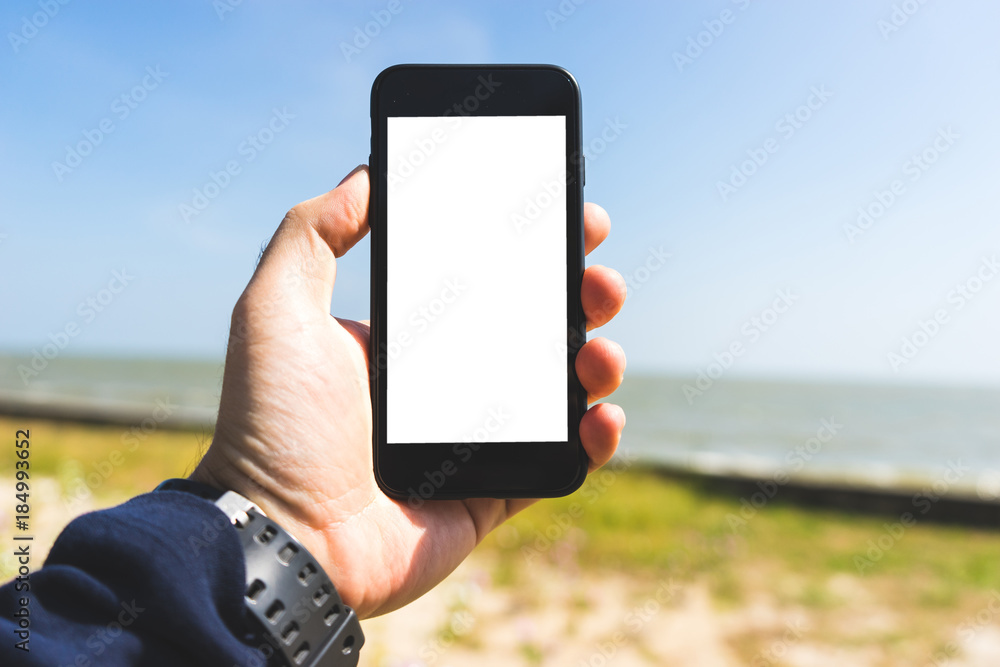 hand on smartphone Concept travel on vacation