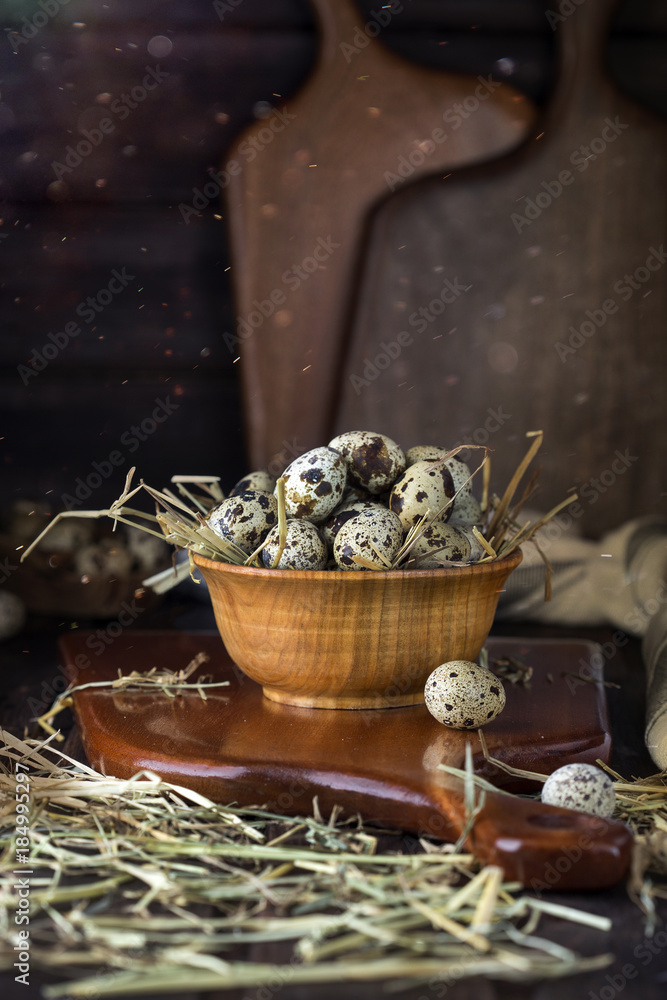 quail eggs in a wooden bowl