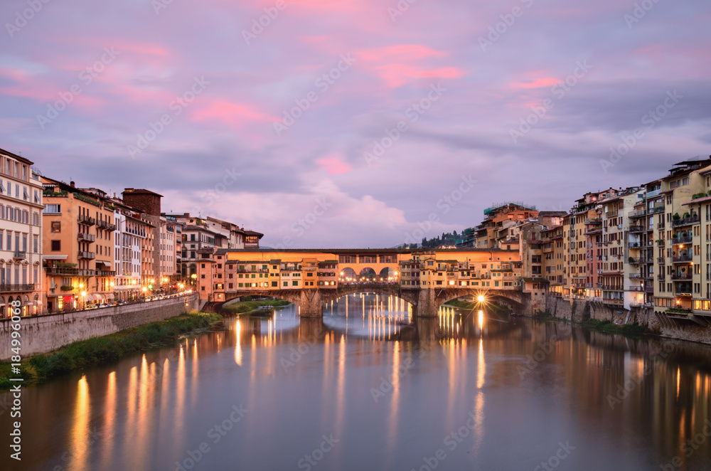 Ponte Vecchio at sunset from Ponte alle Grazie in Florence, Italy