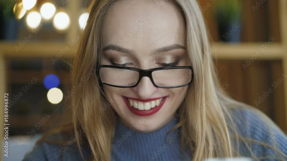 Close up of pretty girl in glasses using tablet in cafe 4K Close up of pretty girl in glasses using tablet in cafe 4K