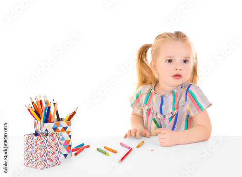 Little girl drawing against...