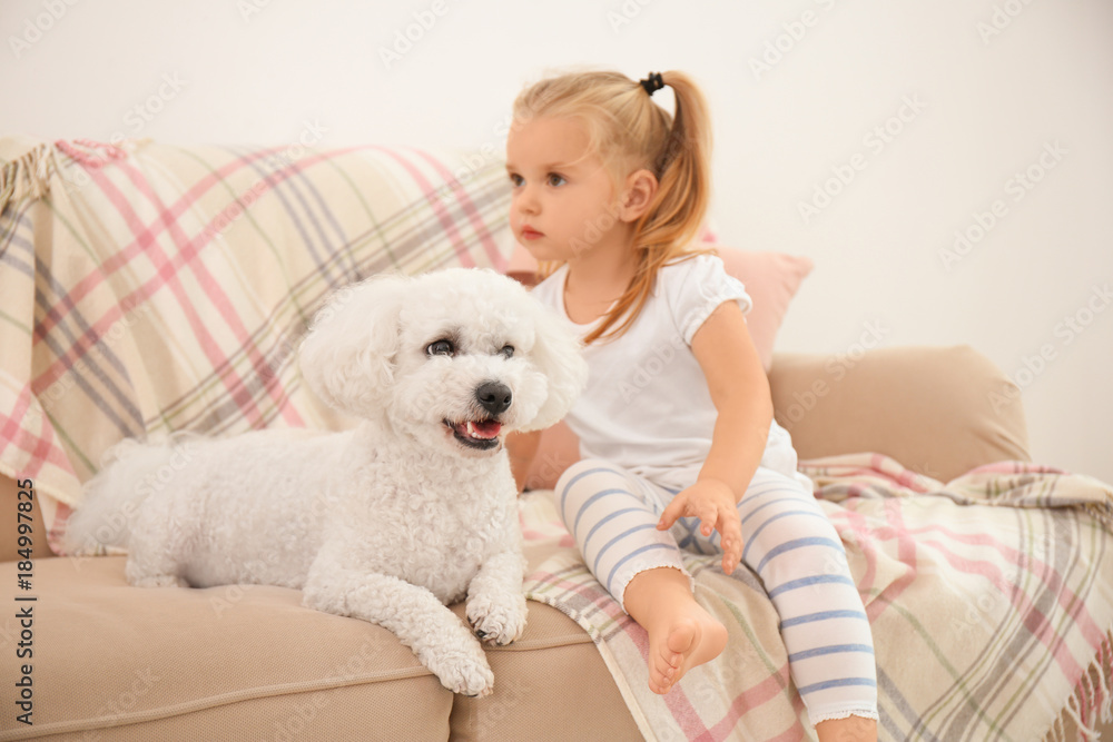 Adorable little girl with her dog at home Adorable little girl with her dog at home