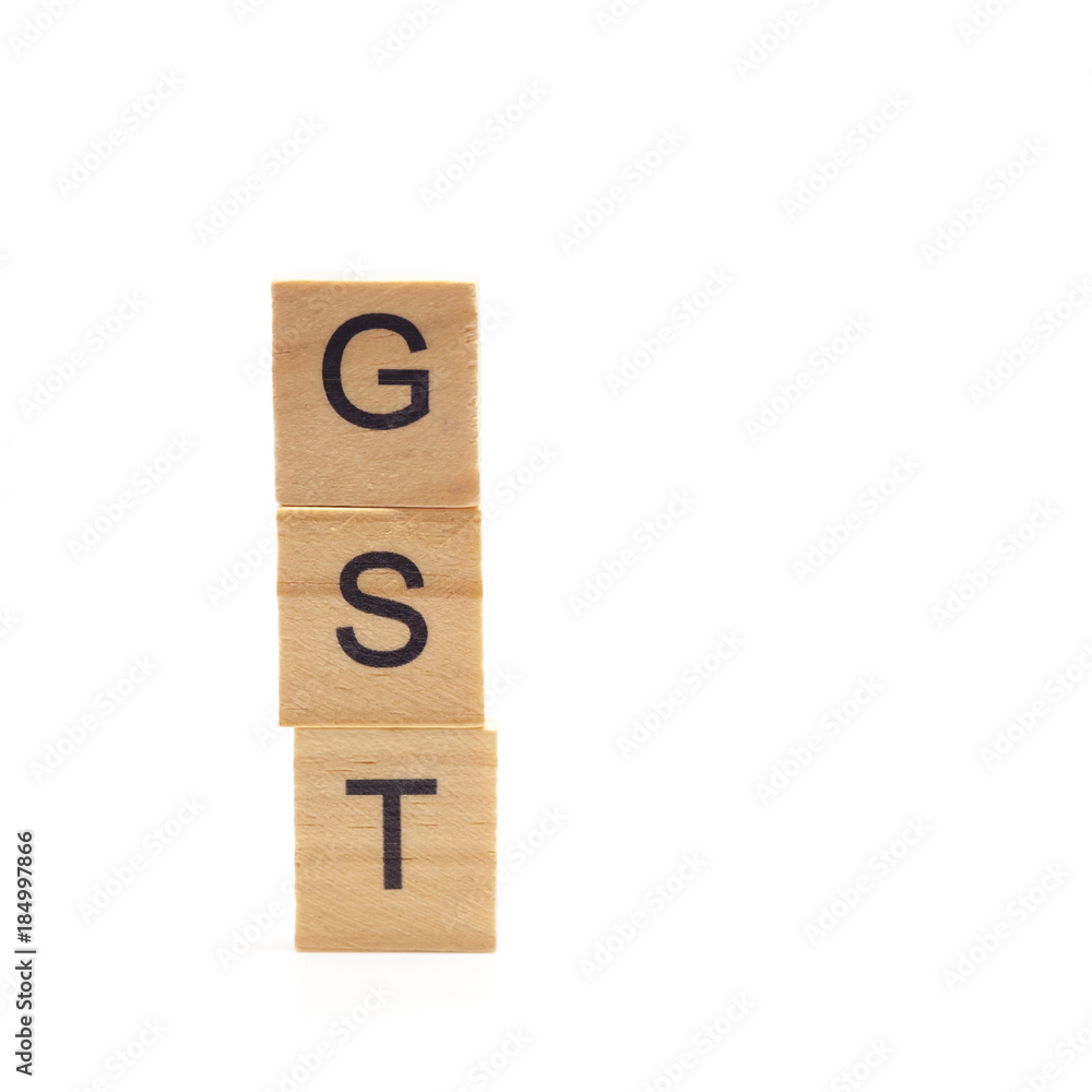 Goods and Services Tax word on stack coins isolate . Goods and Services Tax word on stack coins isolate .