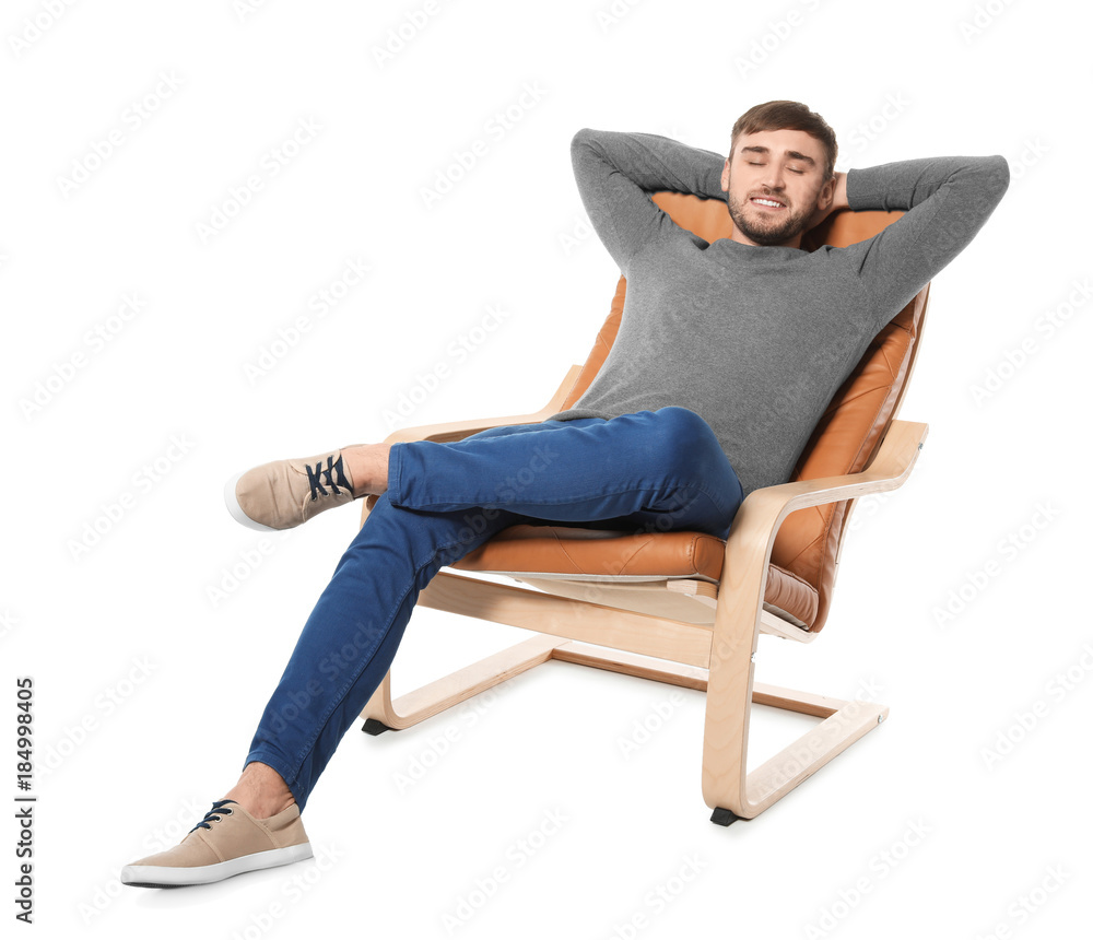 Young man resting in armchair on white background Young man resting in armchair on white background