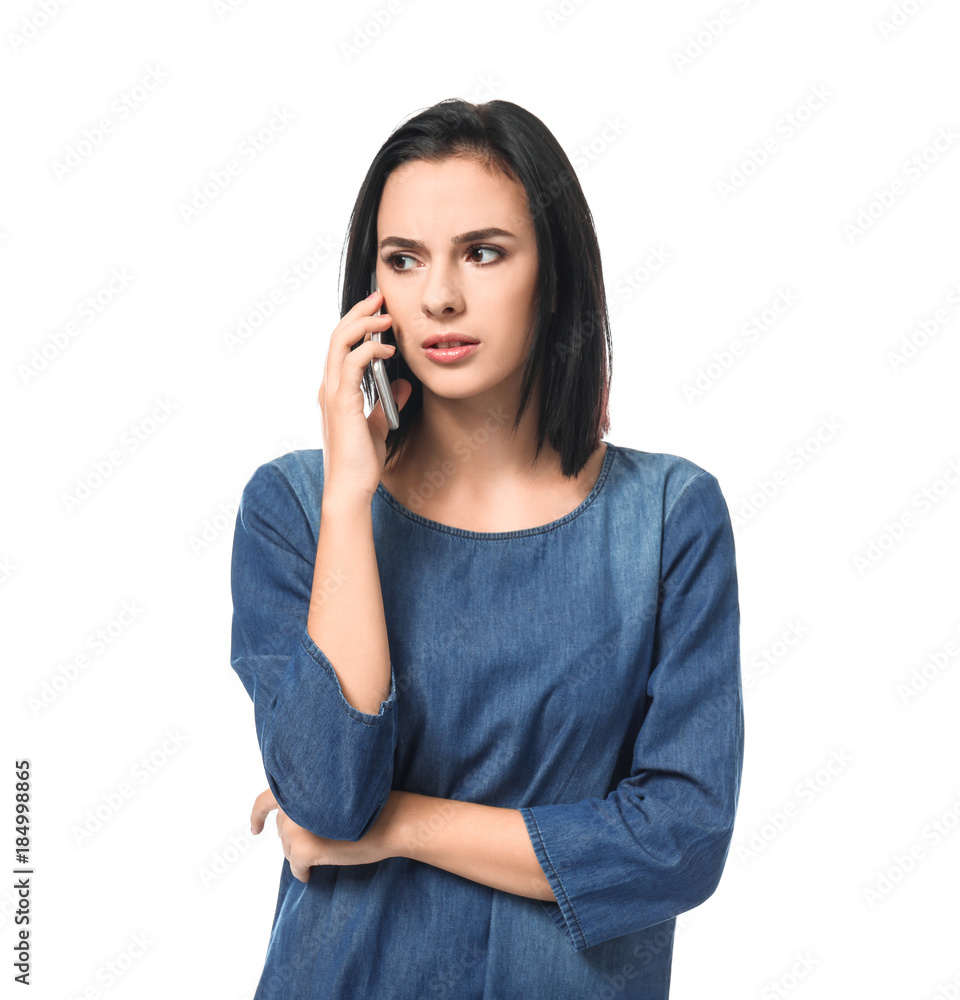 Young woman speaking by mobile phone on white background Young woman speaking by mobile phone on white background