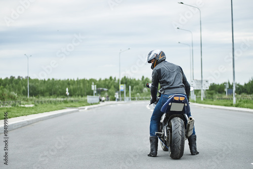 Outdoor pciture of sport motorcycle parked on road against sky background. Extreme, motorcycling, transport, transportation, lifestyle, extreme and hobby concept photo