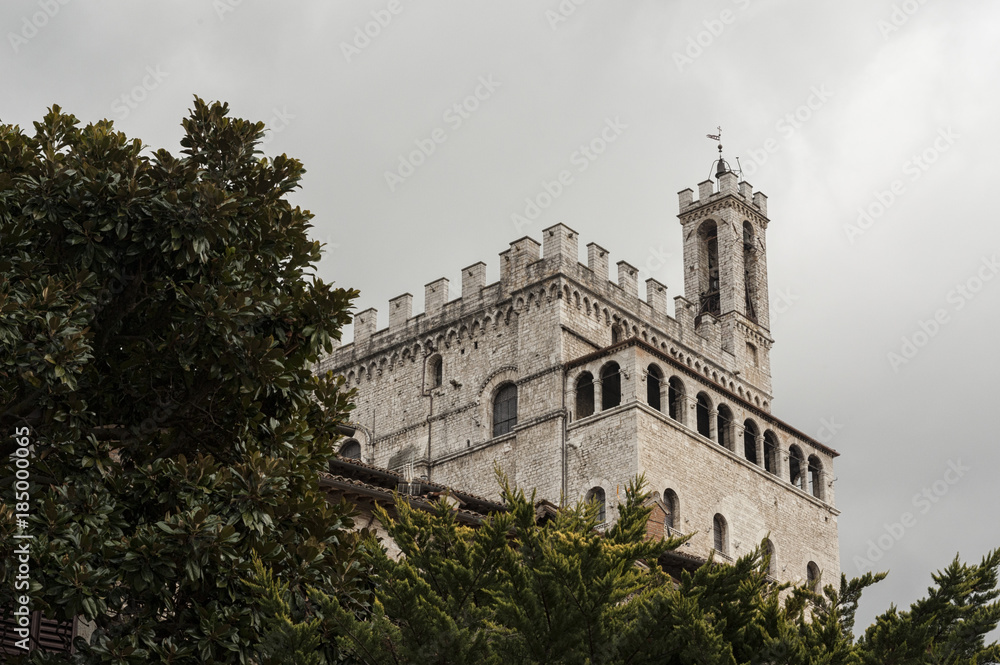 Gubbio, Perugia, Italy - The facade of Palazzo dei Consoli. The palace is located in Piazza Grande, in Gubbio, and is one of the most impressive public buildings in Italy Gubbio, Perugia, Italy - The facade of Palazzo dei Consoli. The palace is located in Piazza Grande, in Gubbio, and is one of the most impressive public buildings in Italy