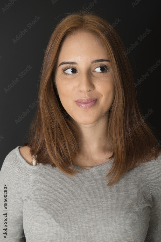 Portrait of a red hair young girl on black background Portrait of a red hair young girl on black background