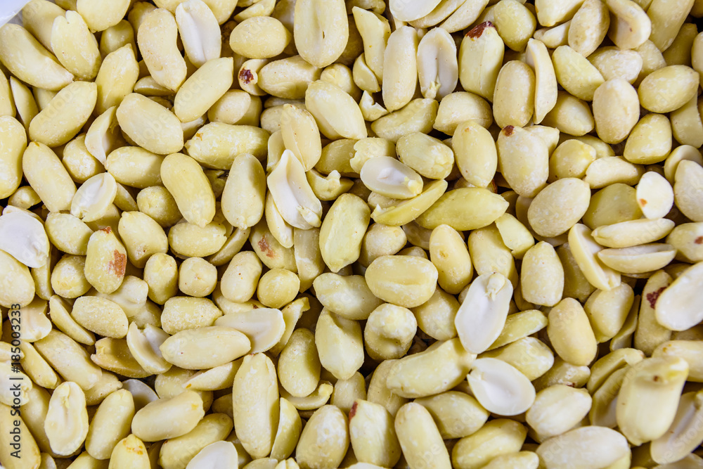 Texture of peeled roasted peanuts for the background Texture of peeled roasted peanuts for the background