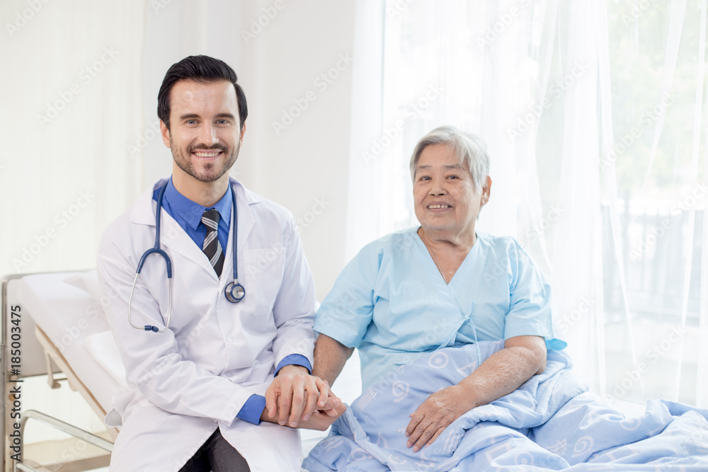 Doctor and early woman smile together at hospital, people with medicine concept.