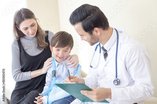 Doctor treat children hand at hospital. People with medical concept. photo