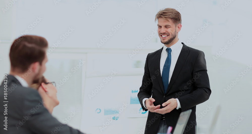 Fototapeta premium Successful business presentation of a man at the office