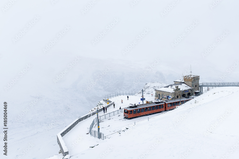 Obraz premium Red train of Gornergrat bahn with snow around