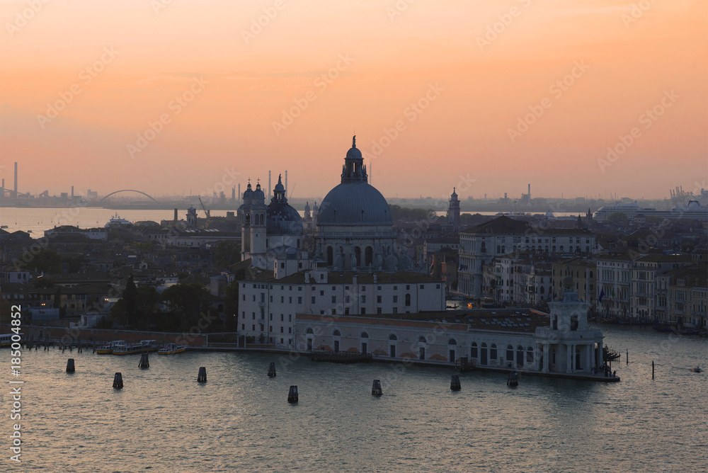 Obraz premium Punta della Dogana Gallery and Santa Maria della Salute сathedral on sunset. Venice