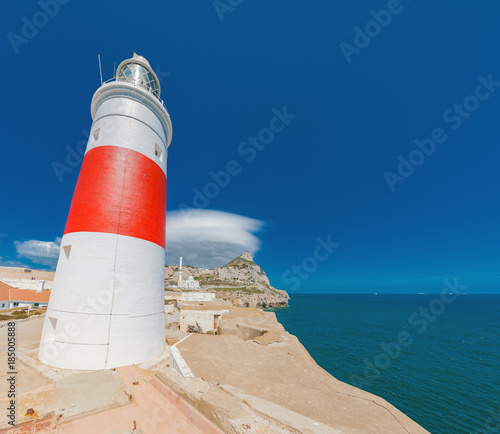 Light house on Europa point, Gibraltar with the pick and wave cloud