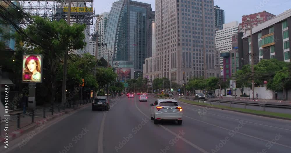 BANGKOK, THAILAND, MARCH 2017: Drive through street view in central Bangkok at sunset
