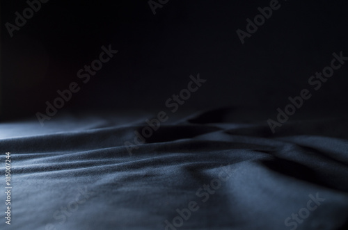 Konstfotografi Dark blue velour with a side light and dark shadows - ideal for product displays