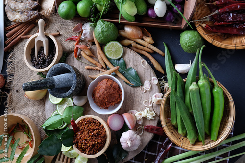 Assortment of Thai food Cooking ingredients. Spices ingredients chilli pepper garlicgalanga and kaffir lime leaves.